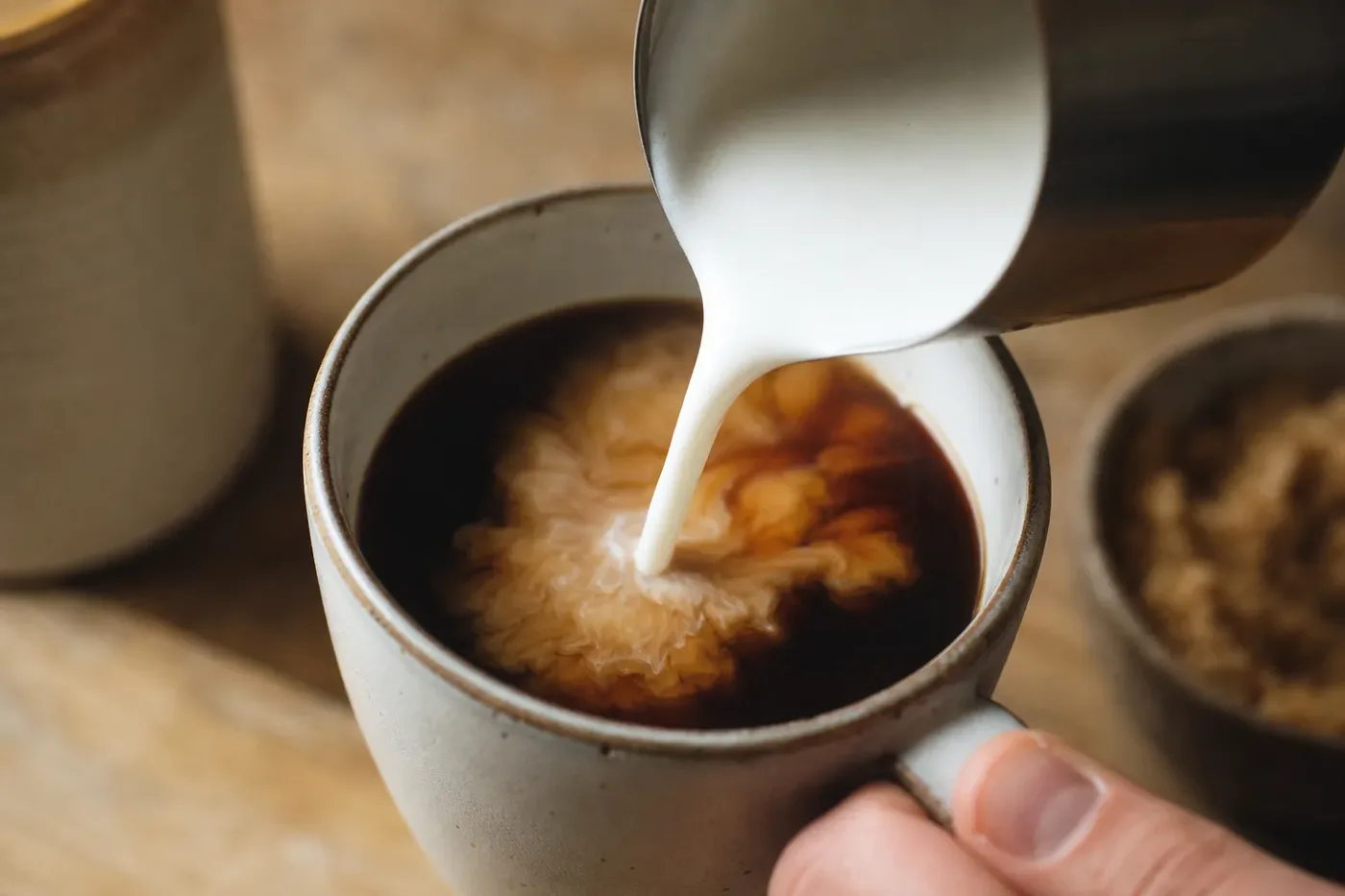 Steamed milk poured into brewed coffee to make a caffe misto