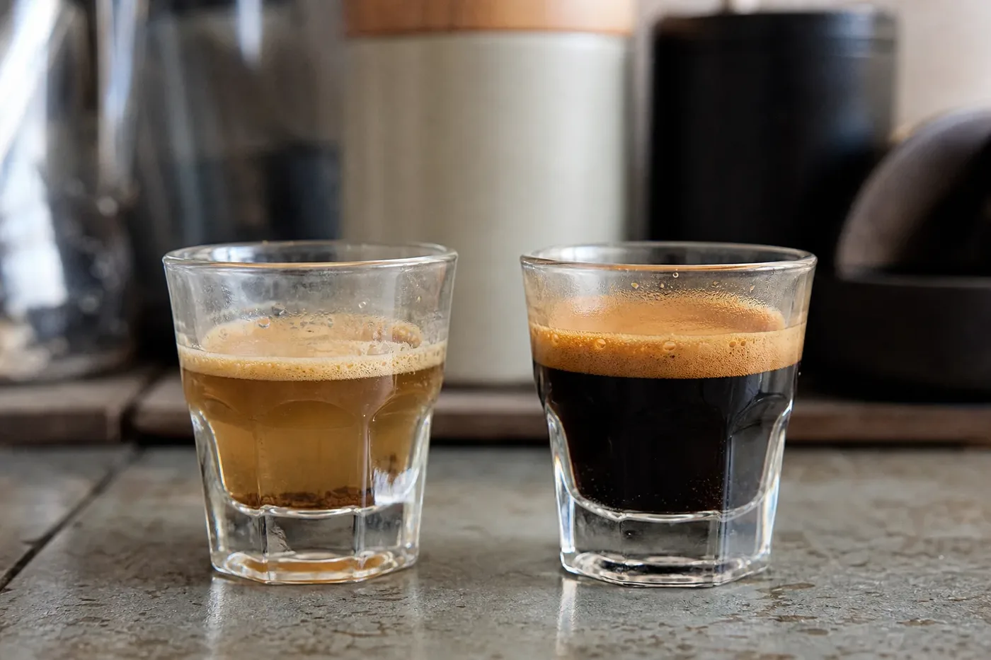 A pale thin under-extracted espresso beside a rich properly extracted shot