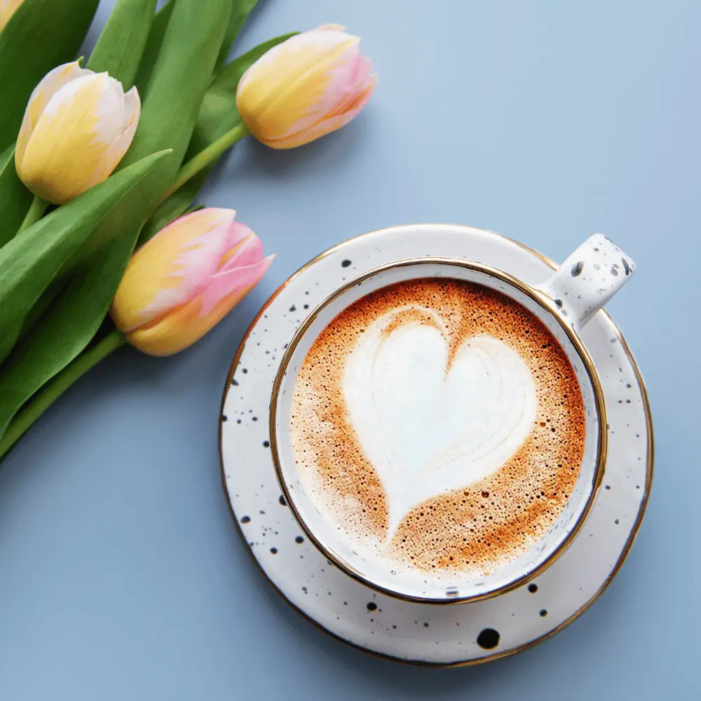 tulips and a latte with a heart foam design