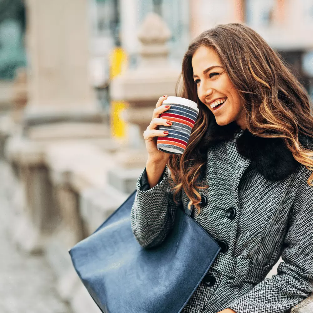 a beautiful woman enjoying her cup of coffee