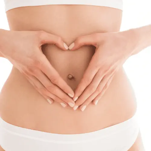 woman making heart with her hands showcasing gut health