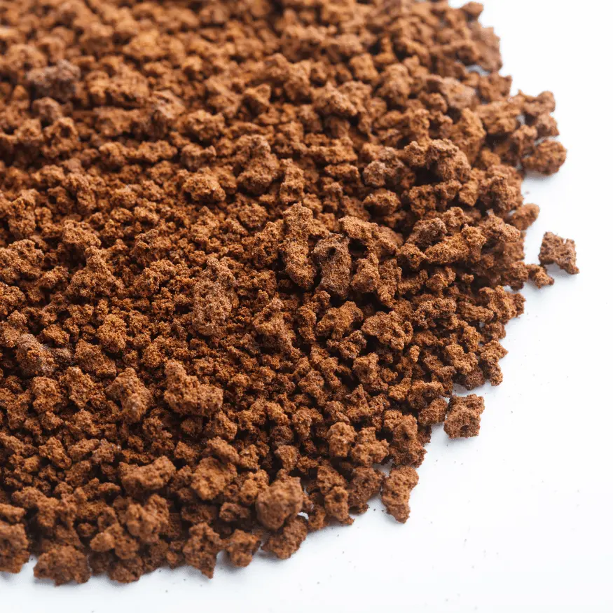 Sanka instant decaf coffee powder on a white background