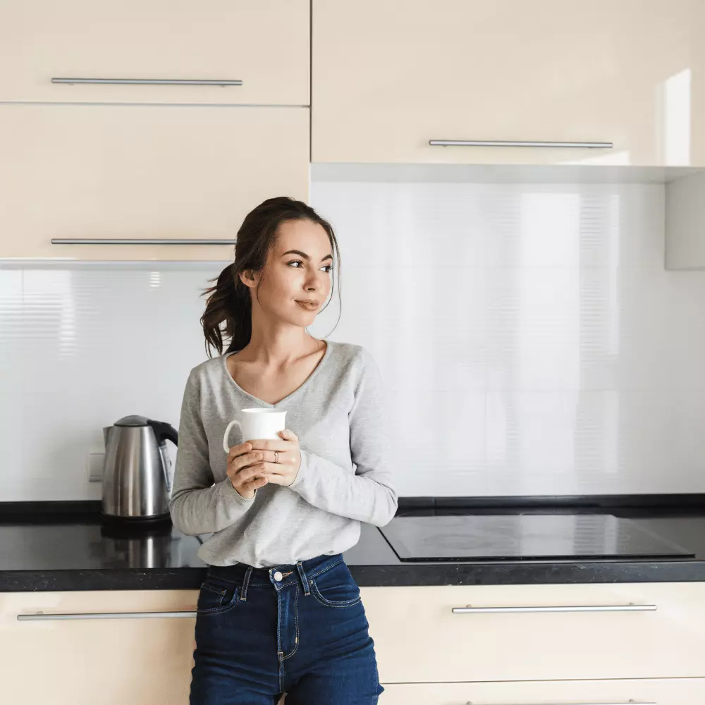 young woman holding a coffee mug while fasting