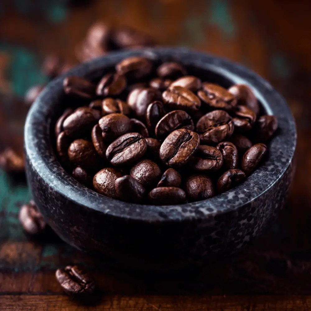 a bowl of dark espresso beans