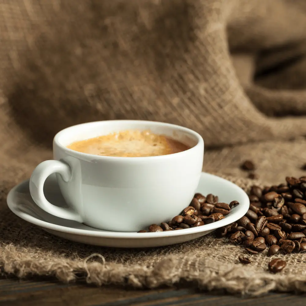 cup of coffee and some coffee beans