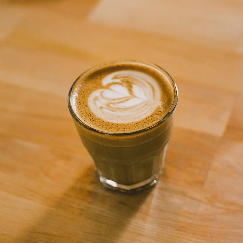 a glass of flat white coffee