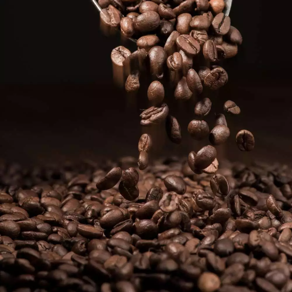 italian roast coffee beans falling
