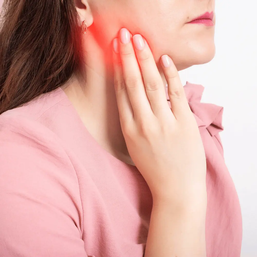 woman in pain after wisdom tooth removal