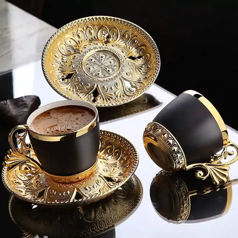 black and gold demitasse cups with saucers
