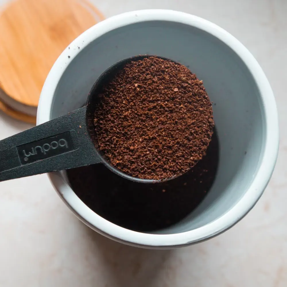 a scoop of ground coffee