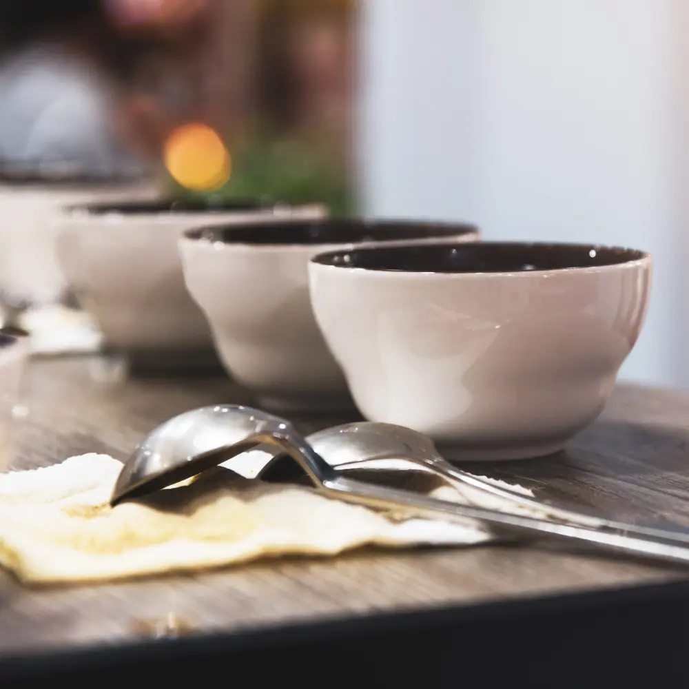 various coffee cupping bowls and spoons