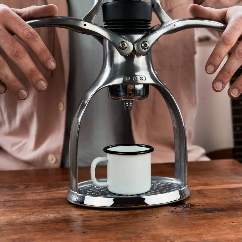 Man using the rok espresso maker