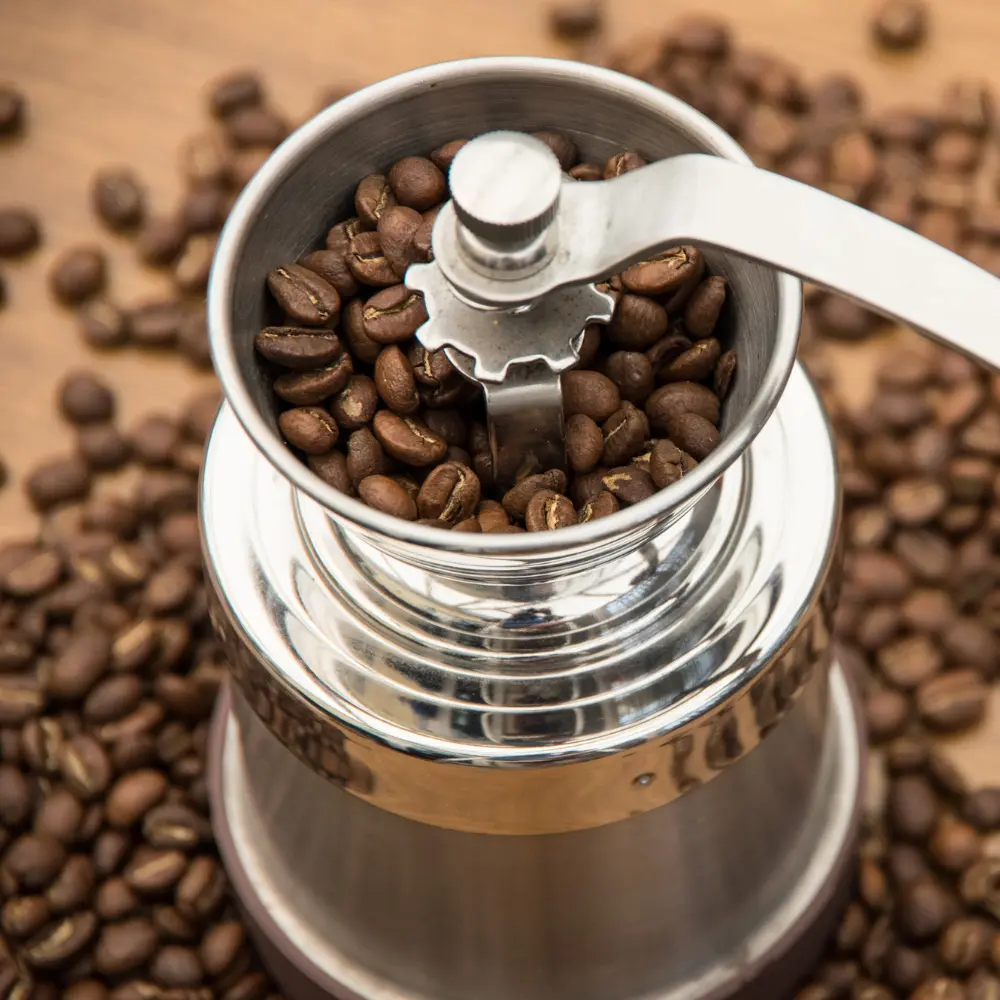 a stainless steel burr coffee grinder with french press coffee beans