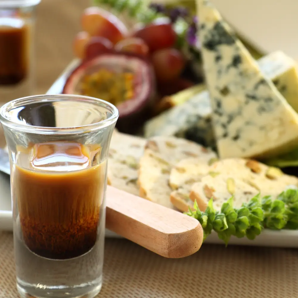shot glass with cheeses and grapes