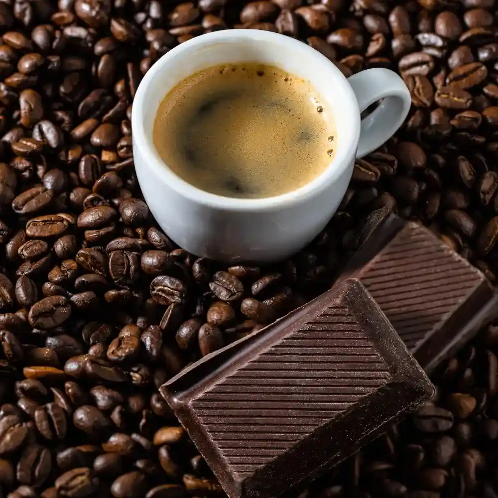 black coffee with dark chocolate and coffee beans