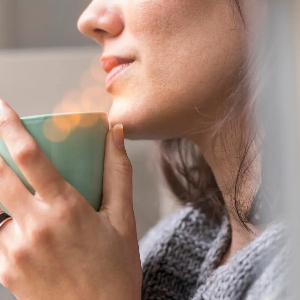 woman enjoying a cup of coffee