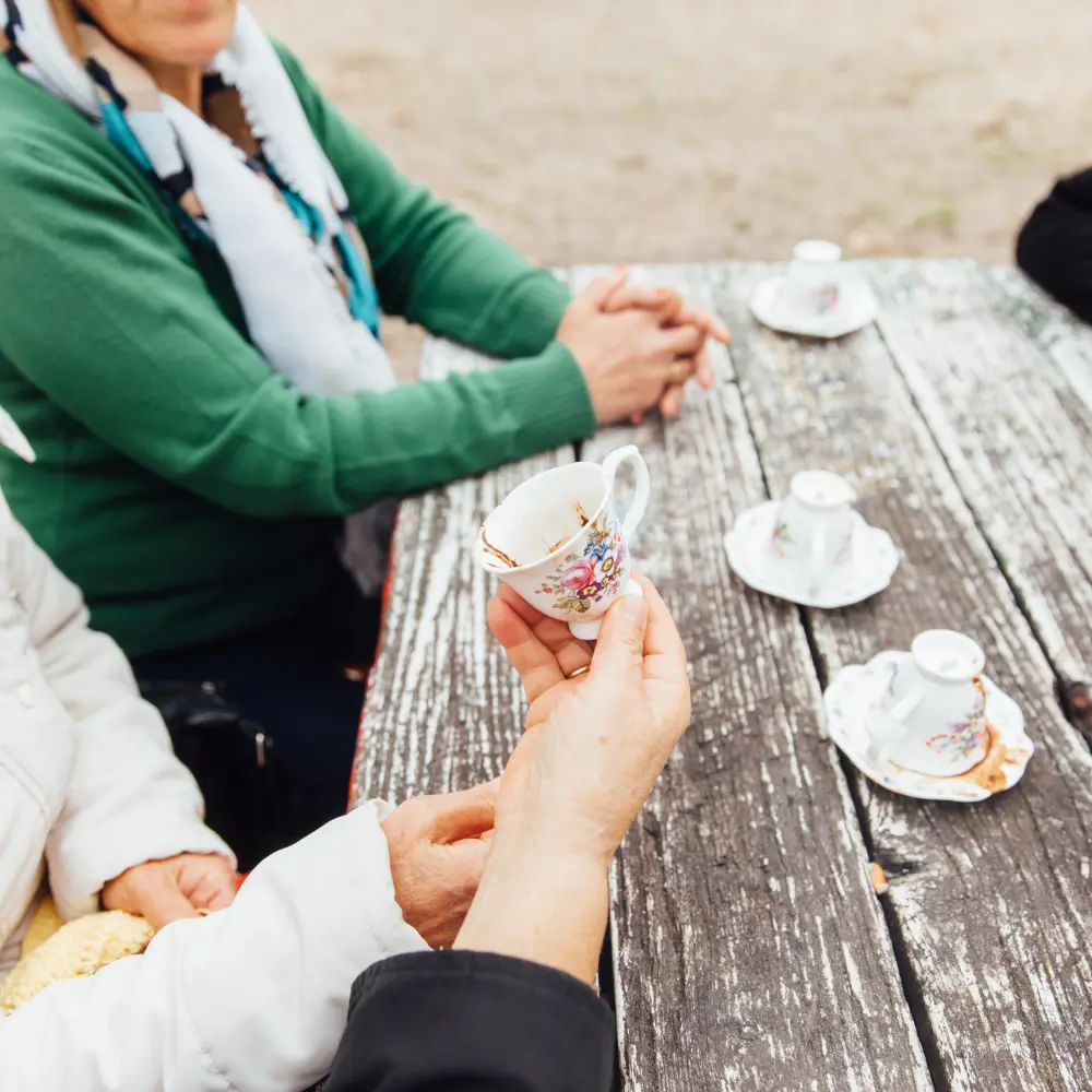 a turkish fortune reading outside on a bench