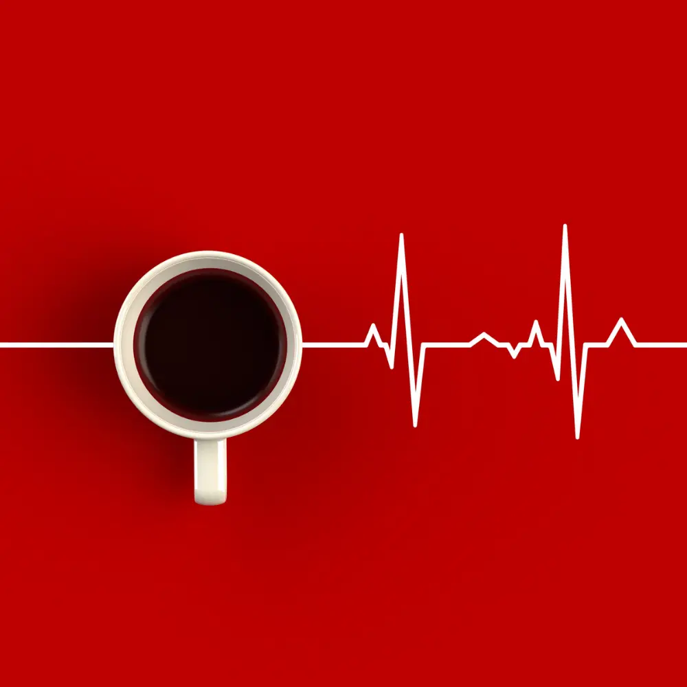 a cup of coffee and a heart monitor