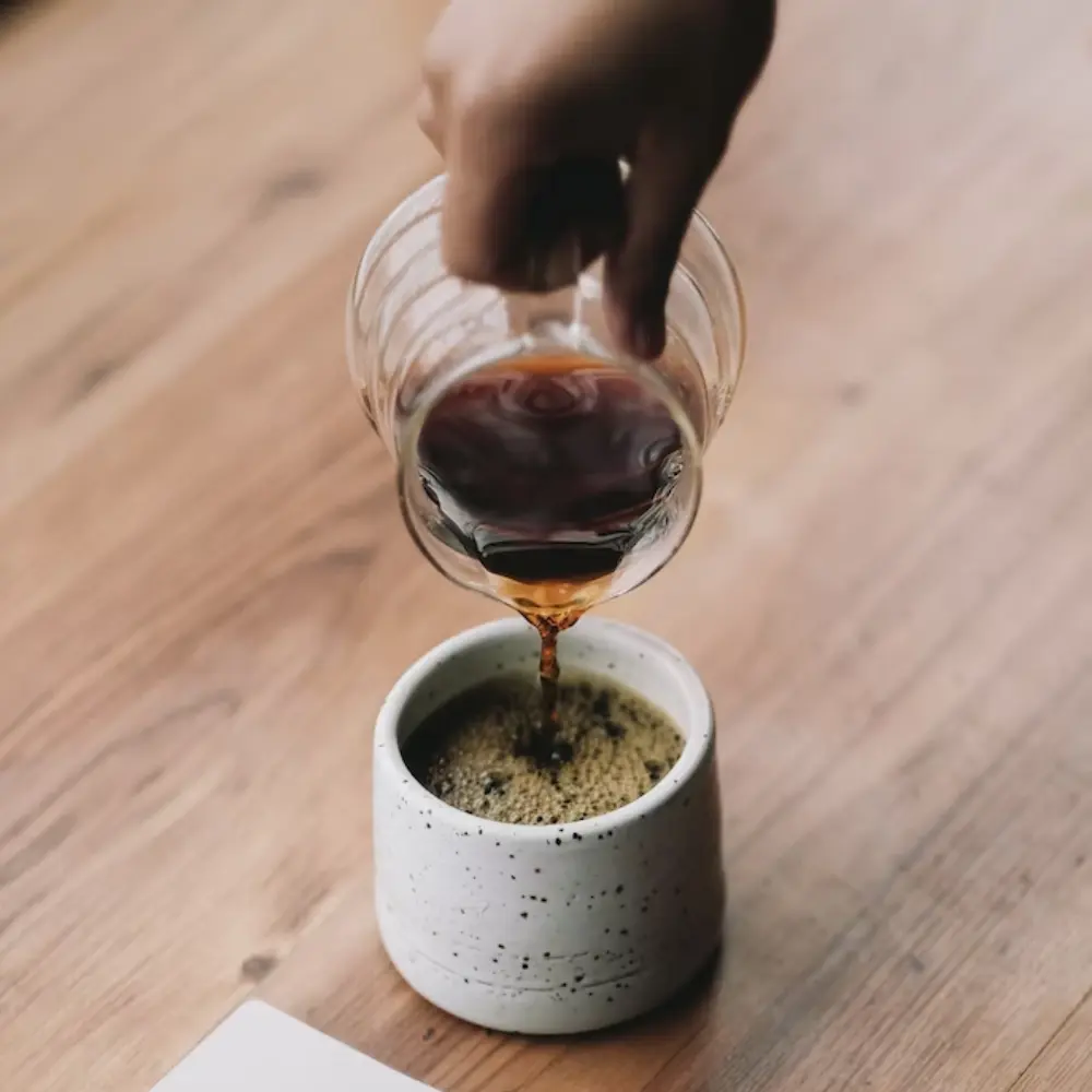 pouring fresh coffee into a cup