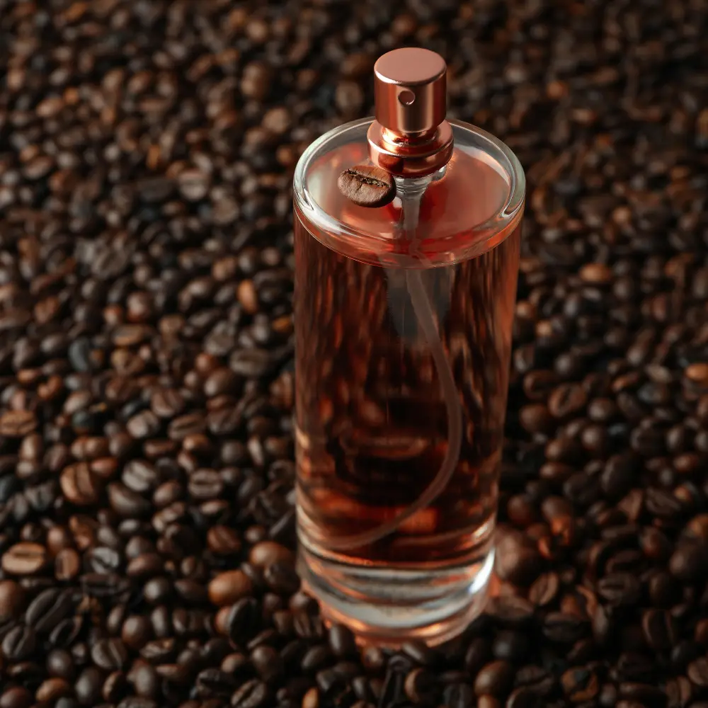 large perfume bottle sitting on coffee beans