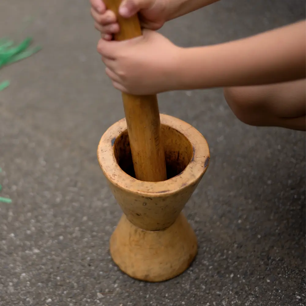 grinding coffee beans using a mukecha and zenezena
