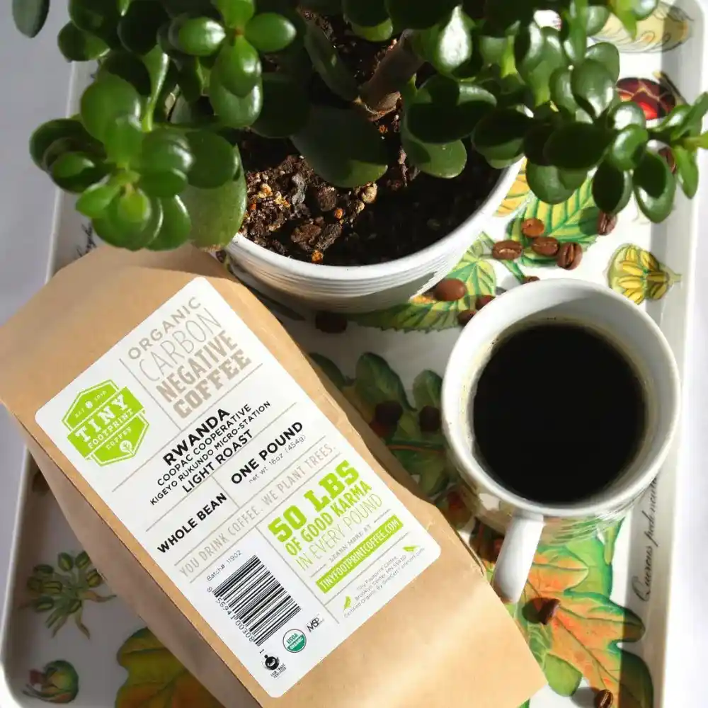 bird-friendly coffee next to a coffee mug