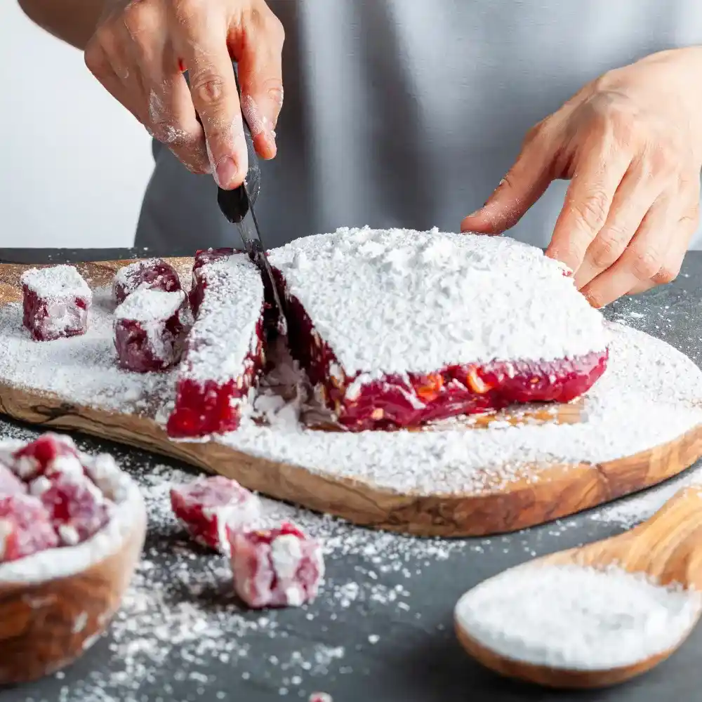 person cutting home made turkish delight