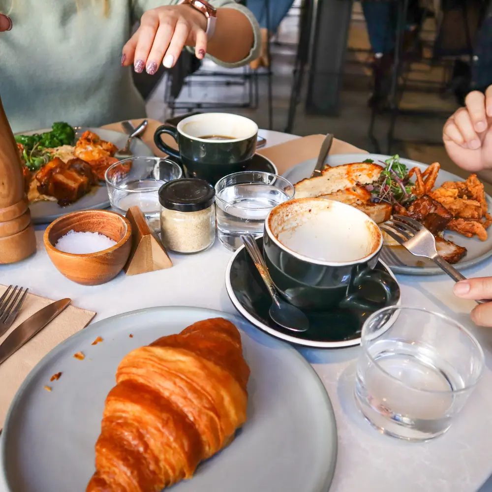 coffee drinks paired with breakfast items like croissant