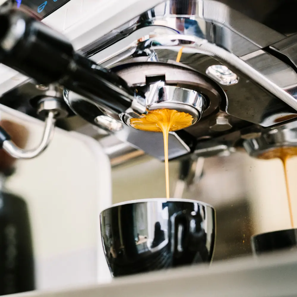 classic espresso machine pulling an espresso shot