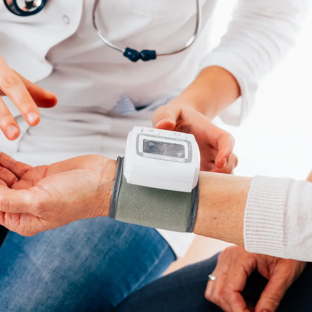 man getting his vitals checked by a doctor