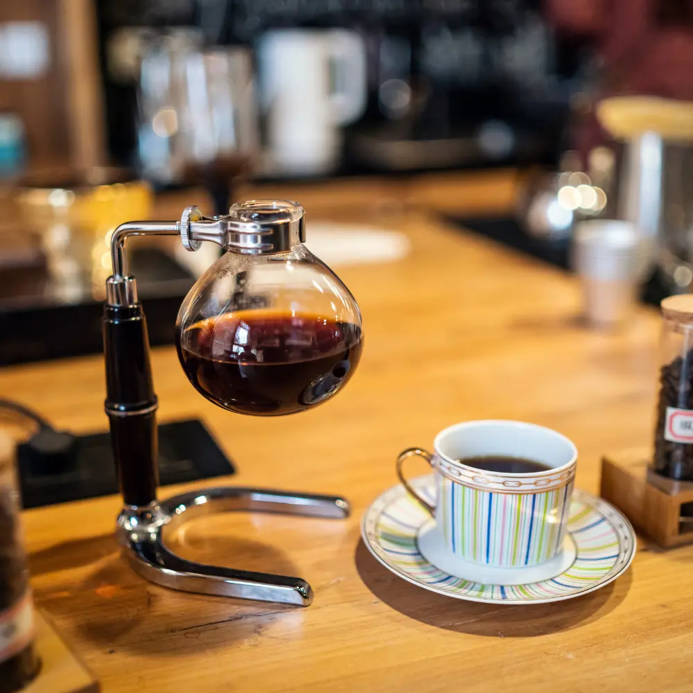 siphon coffee maker brewing coffee