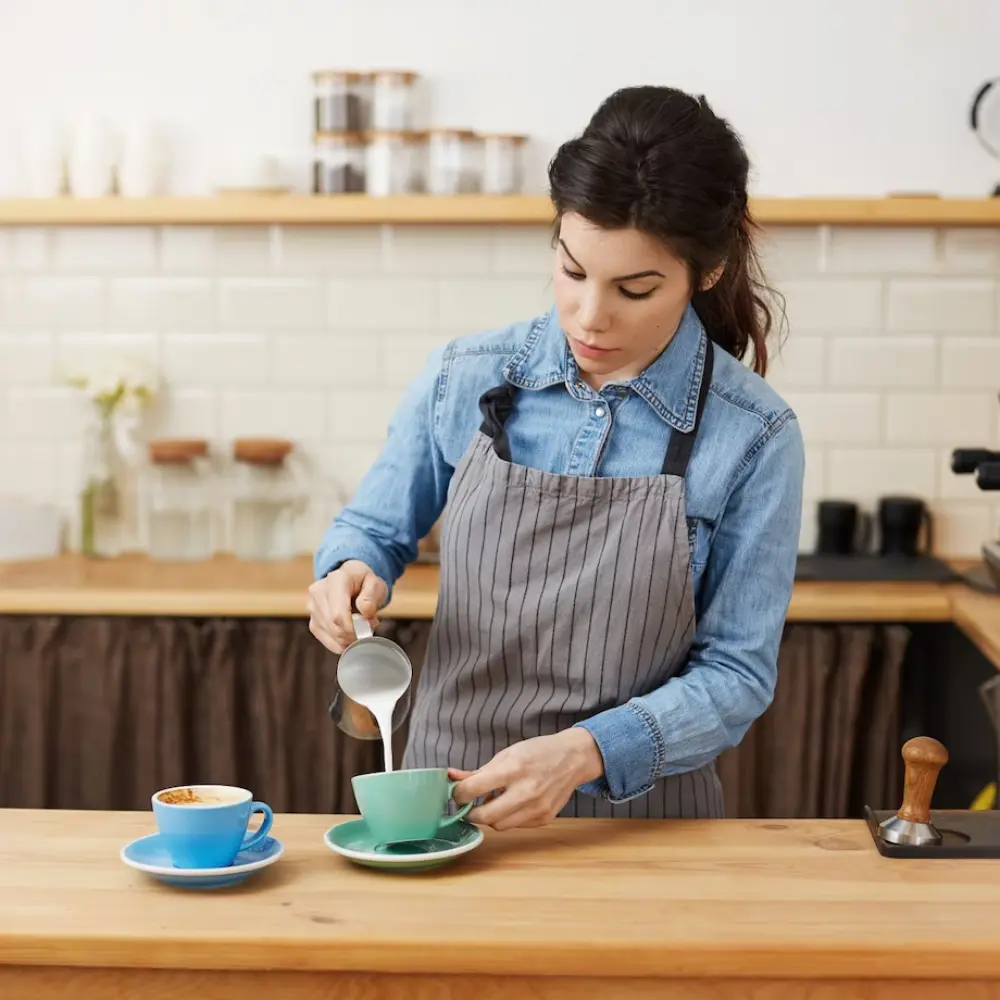 barista making a mocha coffee