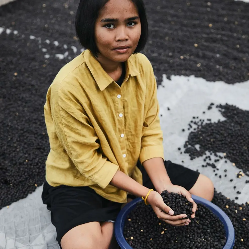 woman working with coffee beans