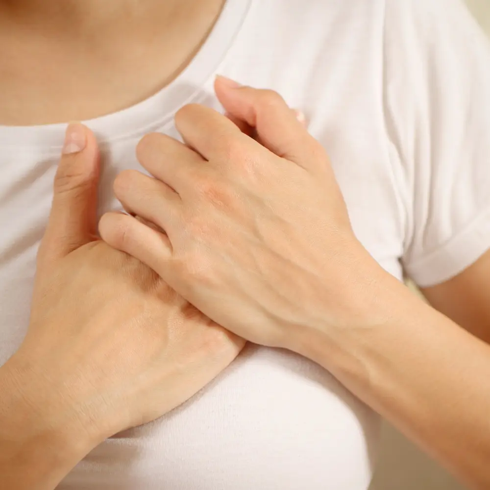 woman holding her chest
