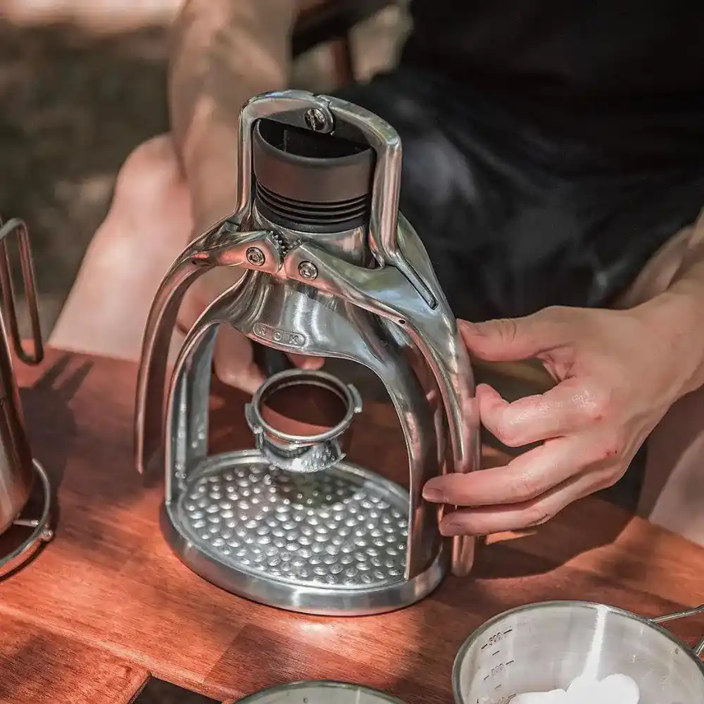 man setting up the rok espresso maker
