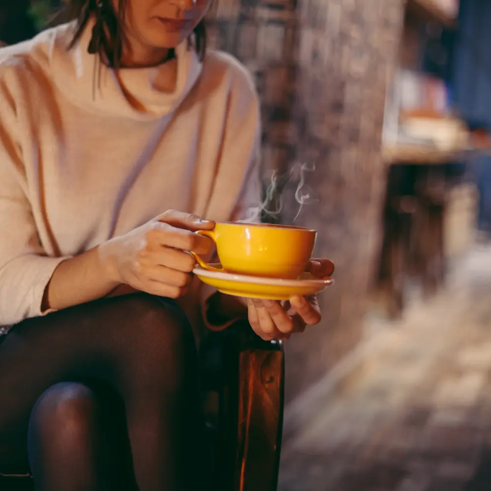 woman enjoying a cup of coffee