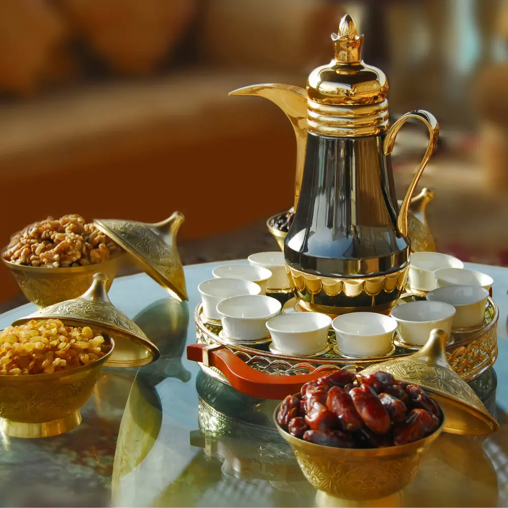 arabic coffee served on a platter and dallah coffee pot