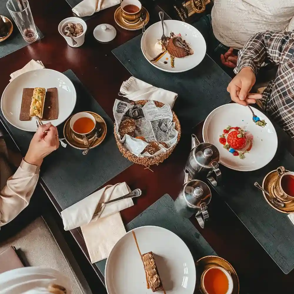 guests eating and drinking coffee at a cafe