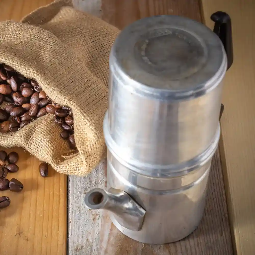 Neapolitan coffee maker and a sac of coffee beans