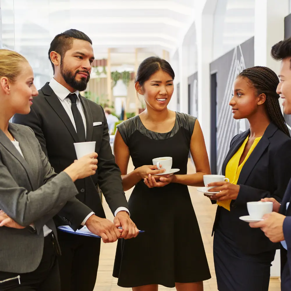a business meeting having coffee