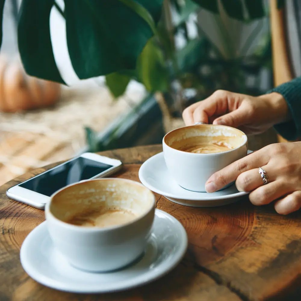 two coffee cups with drunken coffee