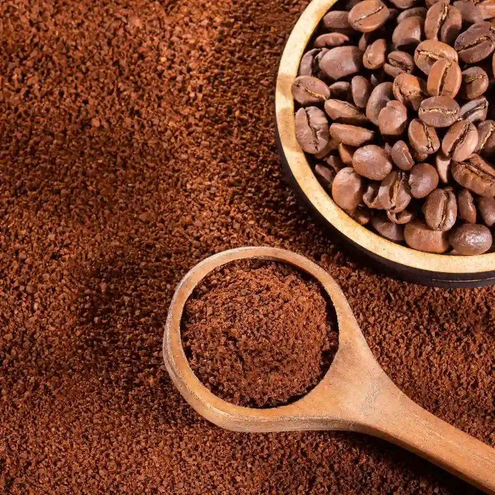 wooden spoon with ground coffee