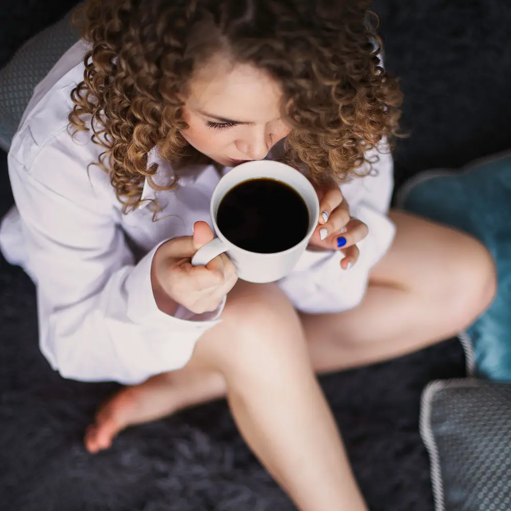 woman enjoying black coffee