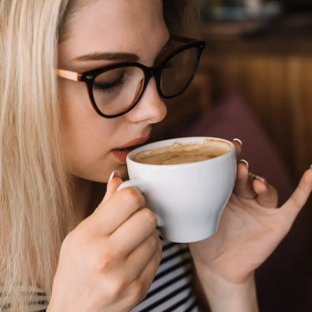 woman enjoying a coffee triple espresso
