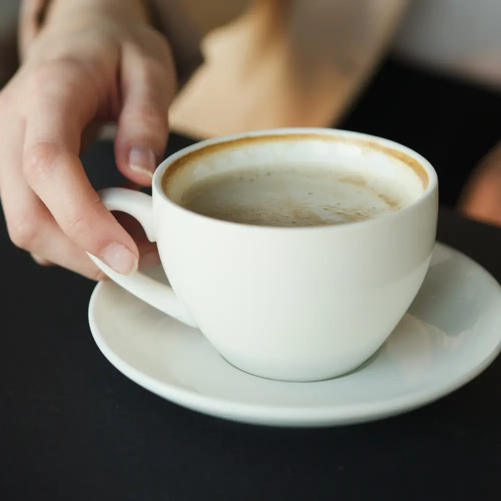 enjoying a cup of coffee
