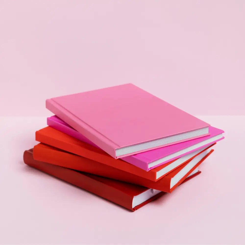 stack of red and pink books