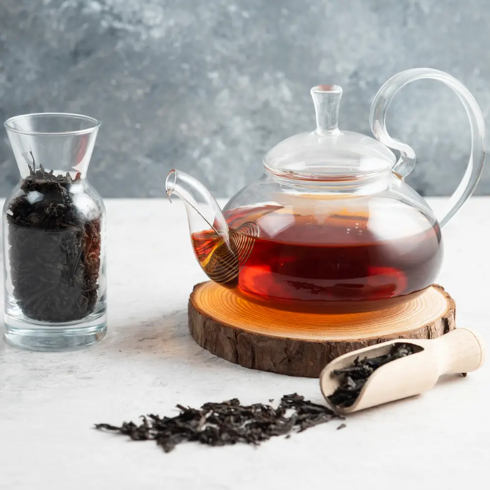 glass pot of black tea