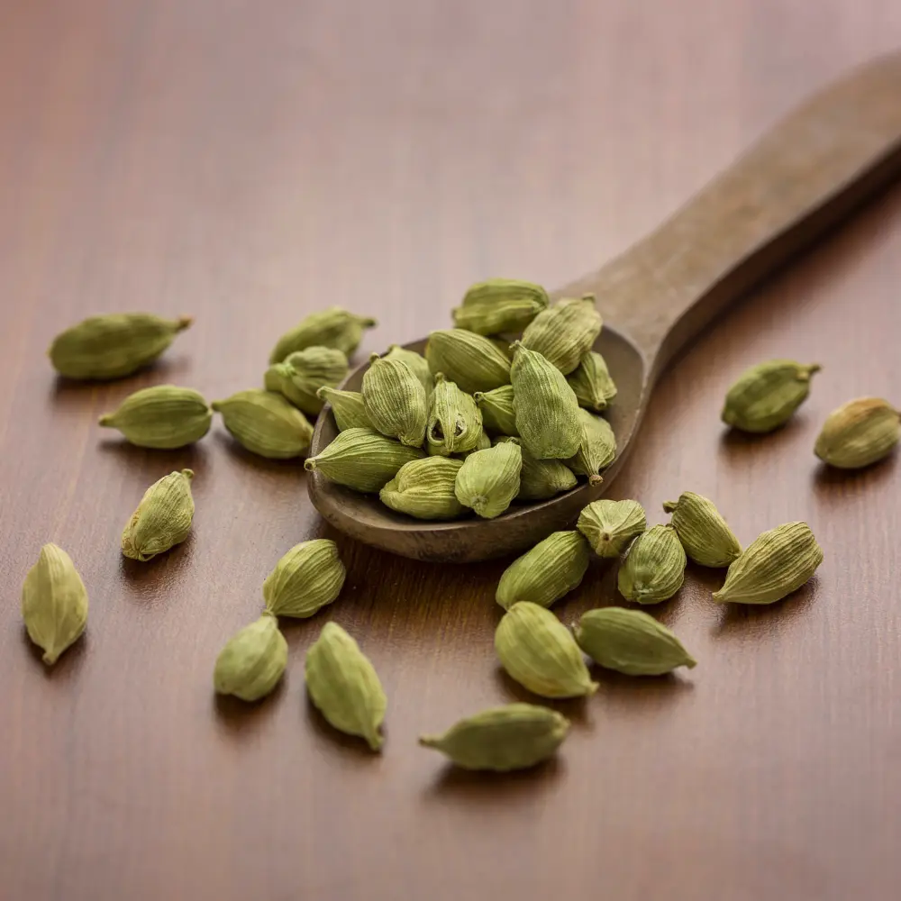cardamom on a wooden spoon