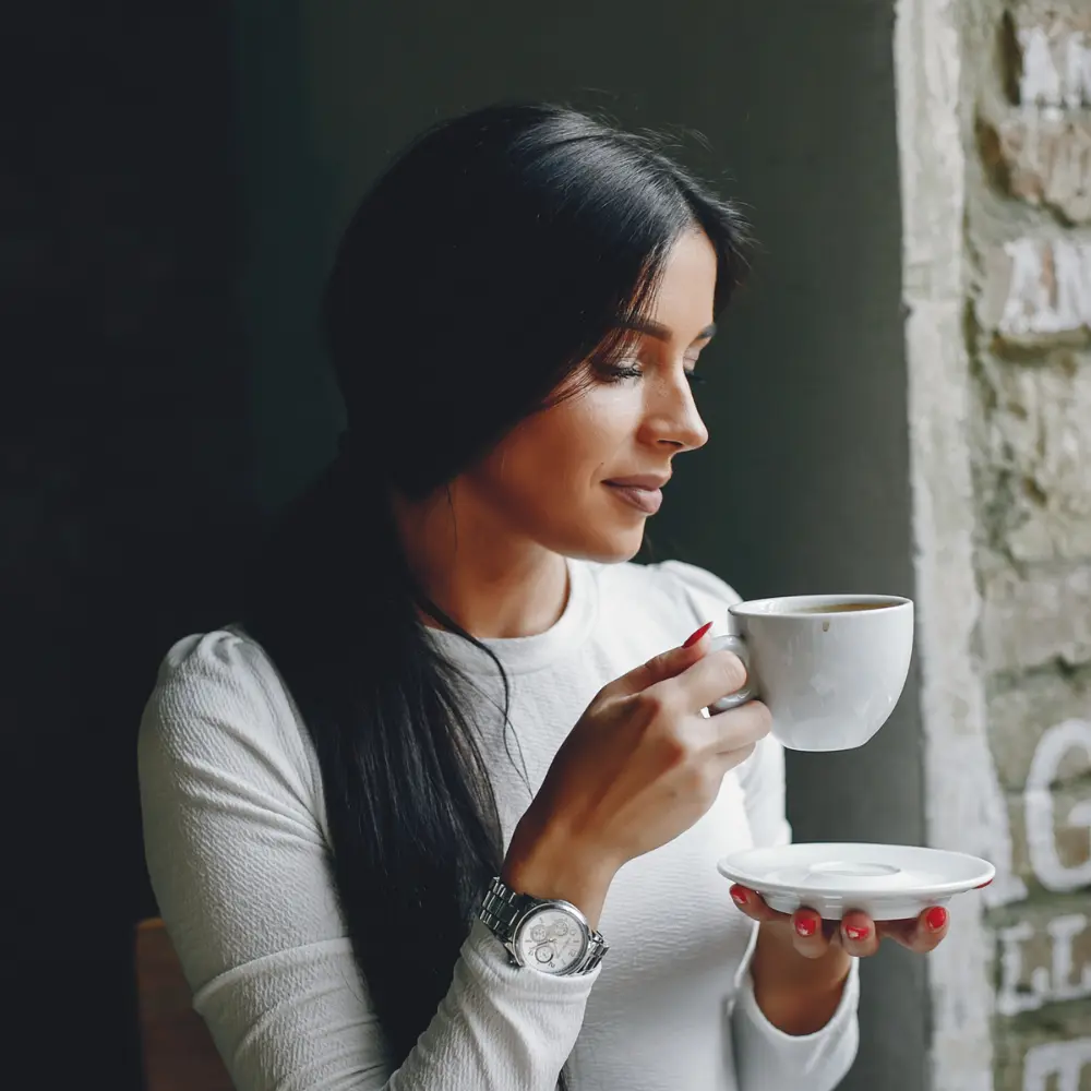 woman enjoying her daily cup of joe