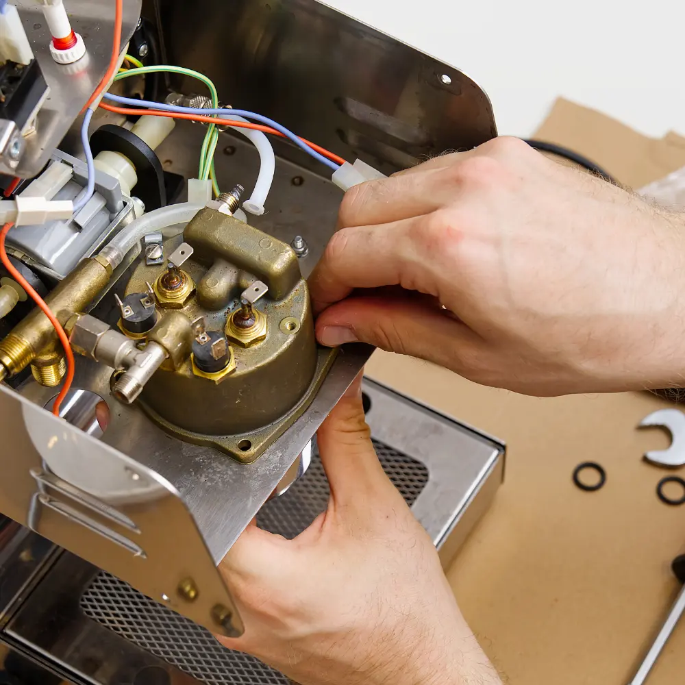 professional technician fixing an espresso machine